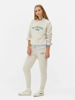 Pantalones De Chándal Pitillo Con Estampado Gráfico